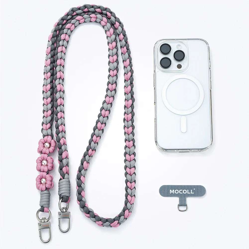 MOCOLL funny phone charm strap braided in pink and gray with flower details and metal clips next to a clear phone case