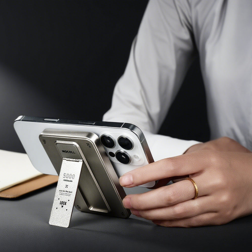 Sleek fast charging power bank with digital display and wireless charging capability on a light background