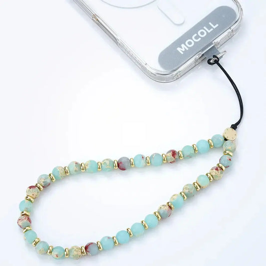 Ling Yun phone accessory beaded phone strap with blue and gold beads attached to MOCOLL phone case
