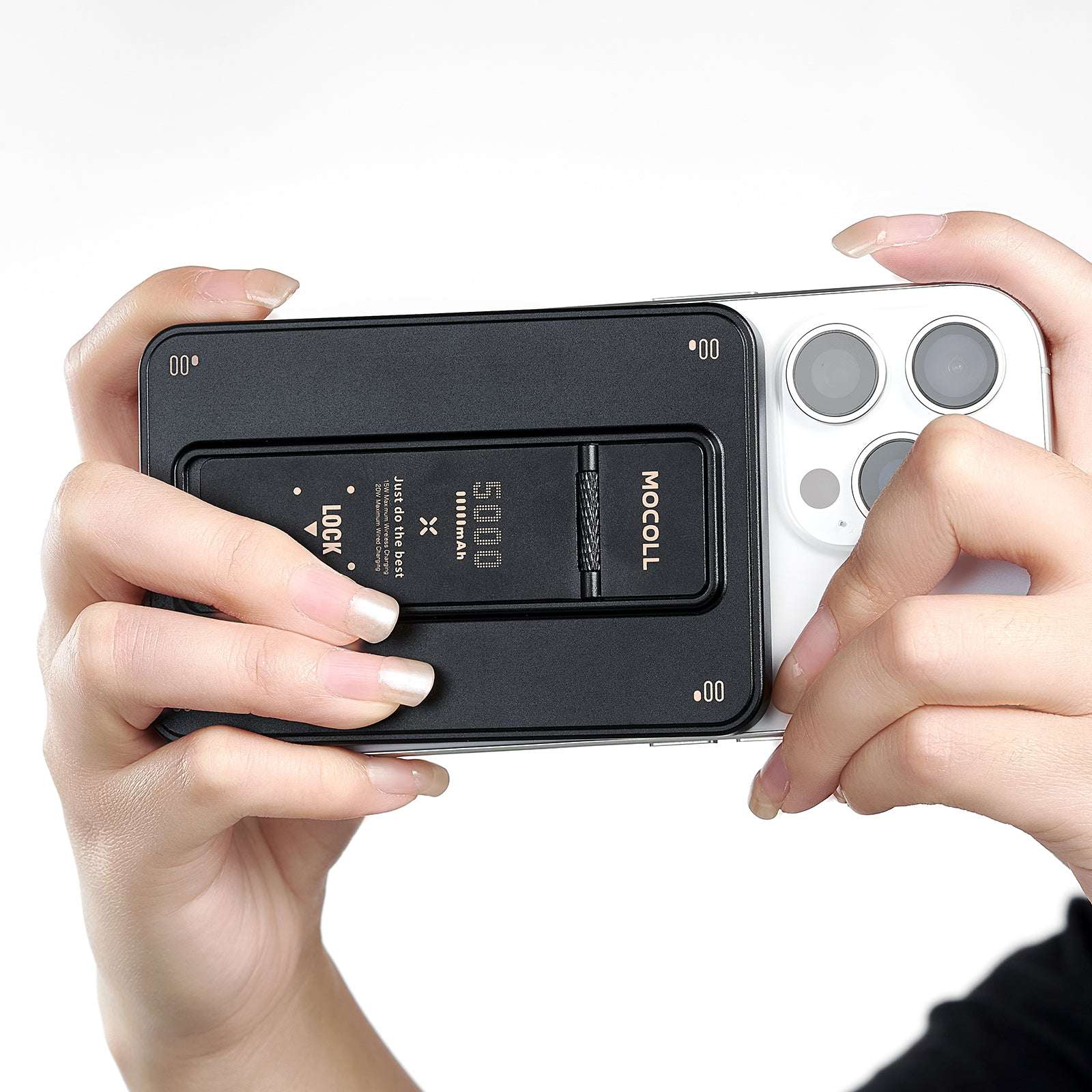 MOCOLL 20W portable power bank attached to the back of a white smartphone held by hands