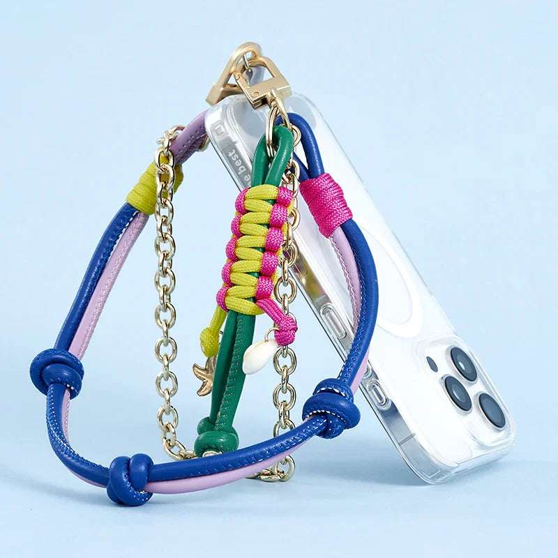 Colorful phone lanyard accessory by MOCOLL attached to clear phone case with gold chain and multicolored cords