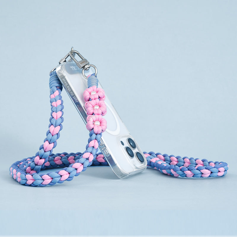 MOCOLL pink and blue braided funny phone charm strap attached to a clear phone case