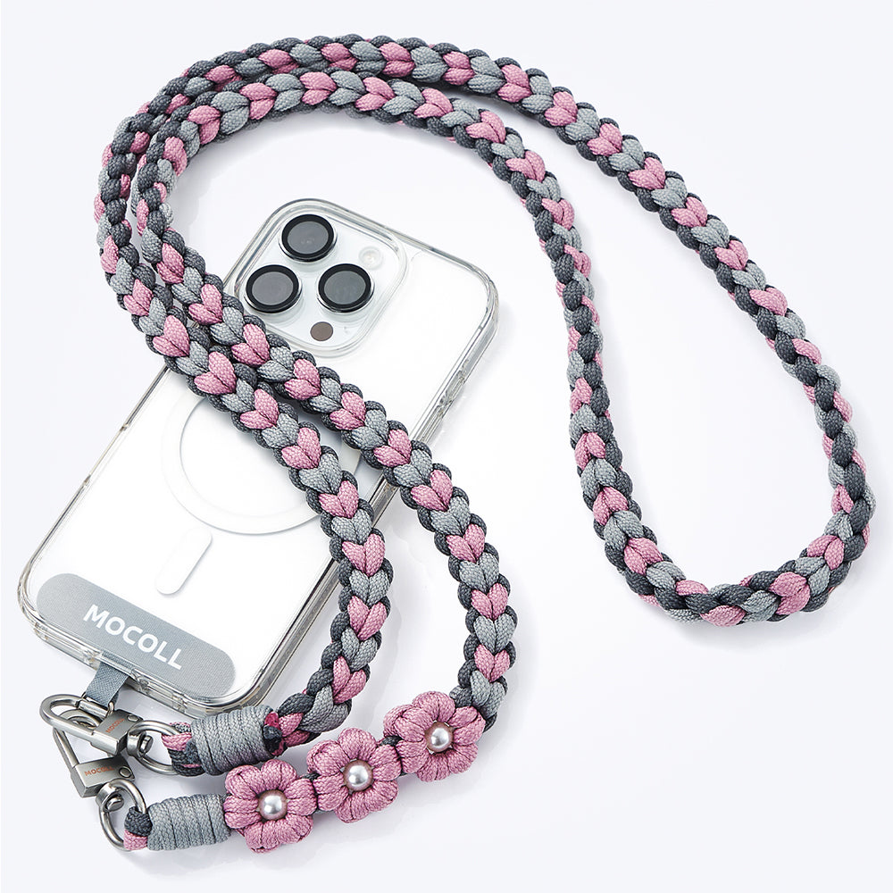 MOCOLL funny phone charm strap braided in gray and pink with decorative flowers attached to clear phone case